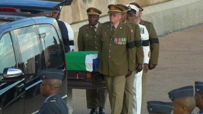 Nelson Mandela's coffin being carried to hearse