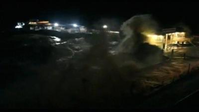 Tidal surge crashing against Cromer Pier