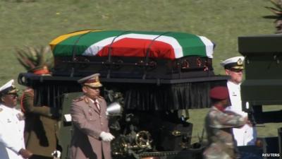 Nelson Mandela's coffin is transported to his funeral in Qunu, South Africa