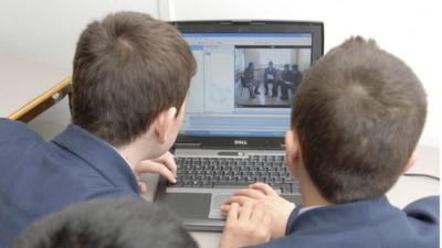 School children using computer