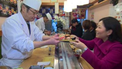 Linda Yueh in a sushi restaurant