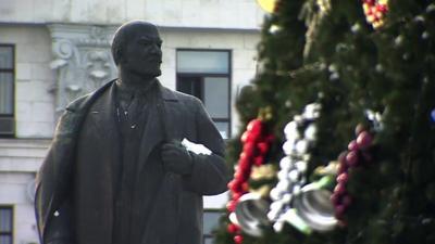 Statue of Lenin and Christmas tree