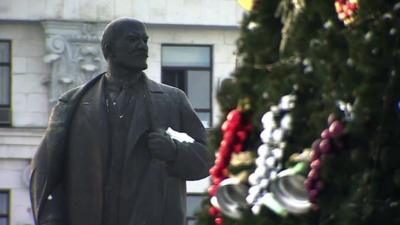 Statue of Lenin and Christmas tree