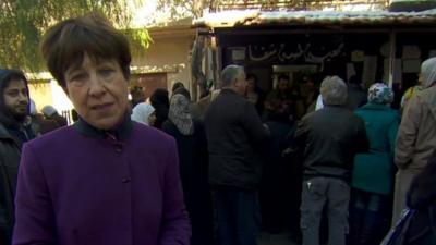 Lyse Doucet with Syrians at a Damascus aid distribution centre