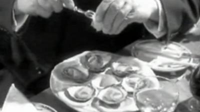 A man eating a plate of Porlock oysters