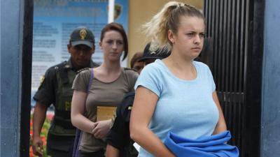 Michaella McCollum and Melissa Reid arrive for a court hearing in Lima, Peru