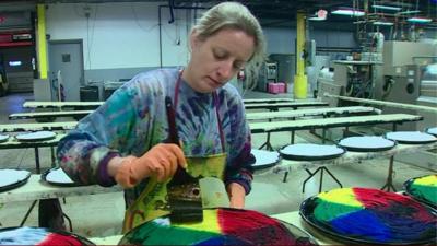 A worker at a factory in the US which is doing well financially