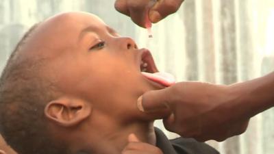 Child being given polio vaccine