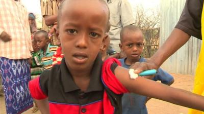 A young boy is given a vaccine in the Dadaab refugee camp in Kenya