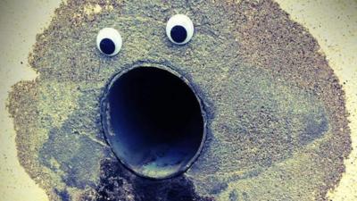 Goggly eyes stuck on a pipe