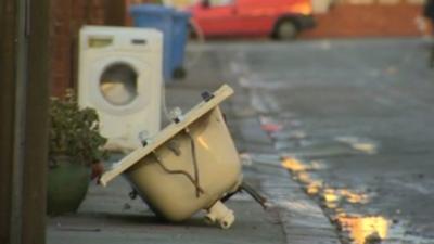 Discarded bath and washing machine on Rhyl street hit by floods in December