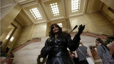 Terri-Jean Bedford gestures while leaving the Supreme Court of Canada following a hearing on the country's prostitution laws, in Ottawa on 13 June 2013