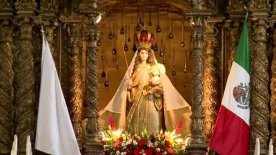 Altar flanked by Mexican flag