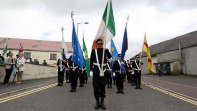 Members of a Republican band take part in a parade commemorating dead IRA members in the village of Castlederg, in County Tyrone August 11, 2013.