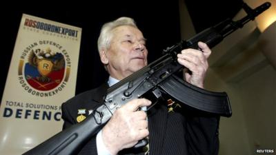 Mikhail Kalashnikov holding rifle