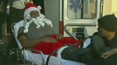 Man dressed as Santa carried into ambulance