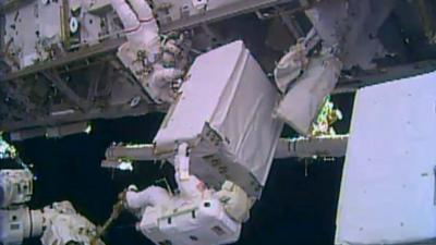 Nasa's Rick Mastracchio and Mike Hopkins moving the replacement pump into place