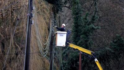 Man fixing power lines in Reigate