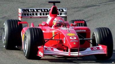 Michael Schumacher steers a Ferrari in 2002