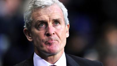 Mark Hughes looks on during Stoke City's 3-0 defeat at Tottenham