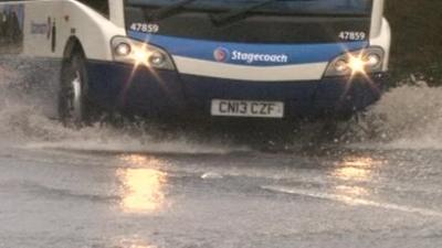 Bus driving through water