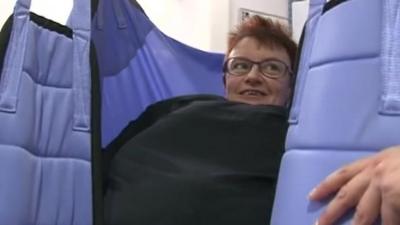 Peterborough City Hospital staff member tries bariatric suit