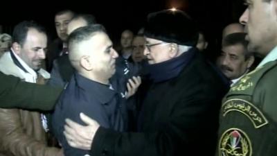 Mahmoud Abbas greets a prisoner