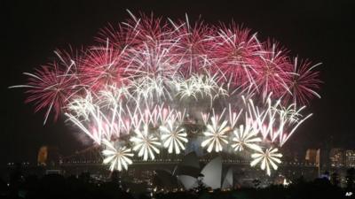 Fireworks explode over the Harbour Bridge and the Opera House during New Year"s Eve celebrations in Sydney