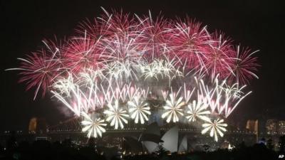 Fireworks explode over the Harbour Bridge and the Opera House during New Year's Eve celebrations in Sydney