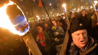 Nationalists hold torches during a march in Kiev