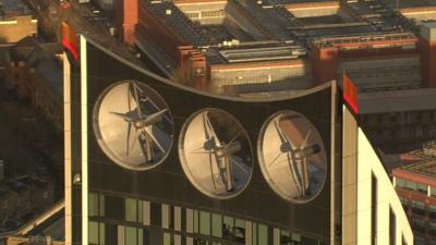 A London building with three wind turbines