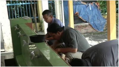 Muslims preparing for prayer in Malaysia