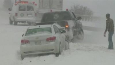 Cars struggling through snow