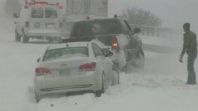 Cars struggling through snow