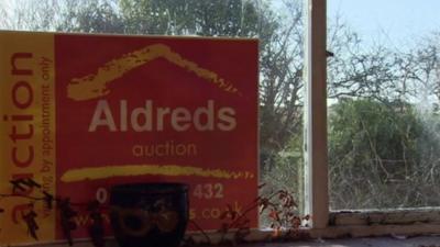 Auction sign in a window