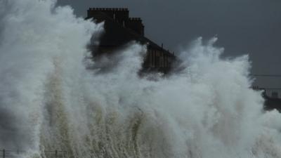Wave hitting homes in Ayrshire, Scotland