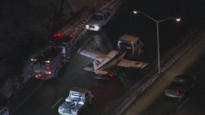 Aerial view of small plane on back of truck