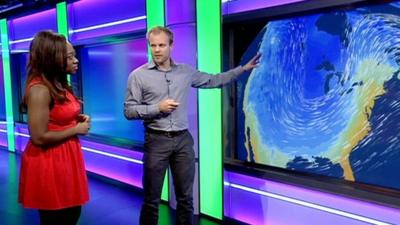 Simon King explains the weather to Ayshah Tull