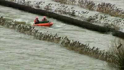 Boat heads for the village of Muchelney