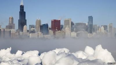 The Chicago skyline is seen beyond the arctic sea smoke rising off Lake Michigan in Chicago