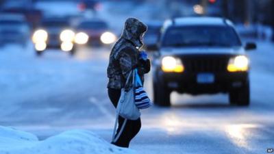 Woman wrapped up in an American street