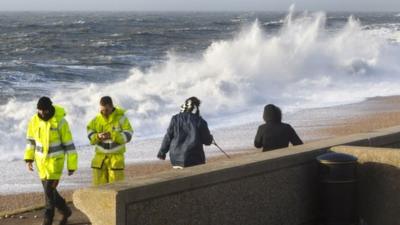 Waves crash onto the beach on Portland, Dorset