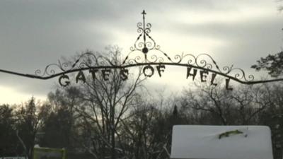Sign saying "Gates of Hell" in town of Hell, Michigan