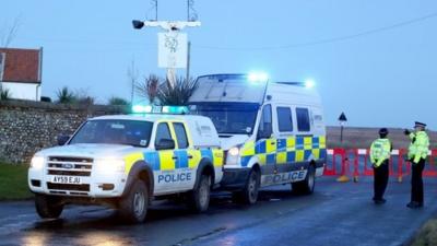 A Police road block at Salthouse in Norfolk following a helicopter crash near Cley-next-the-Sea