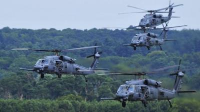 A four-ship fleet of 56th Rescue Squadron HH-60G Pave Hawks flying over RAF Lakenheath