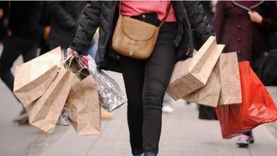 Woman carrying shopping bags