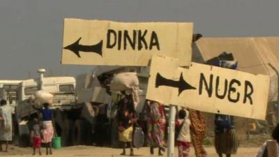 Two signs reading Dinka and Nuer