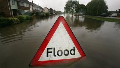 Flood sign in residential street