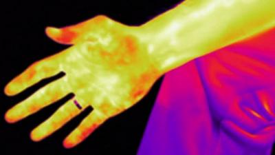 A hand in heat vision