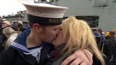 Couple kiss as HMS Illustrious returns to Portsmouth